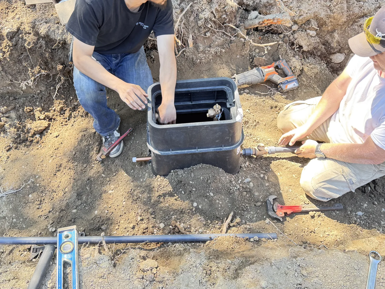Catch basin being set into a drainage trench